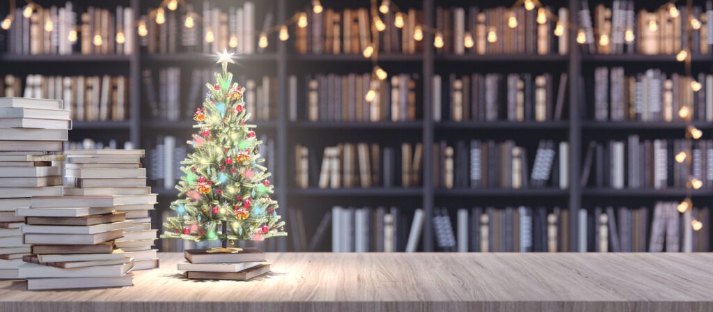 Decorated,Christmas,Tree,On,Bookshelf,In,The,Library,With,Old